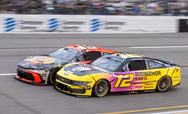 Team Penske driver Ryan Blaney (12) and Joe Gibbs Racing driver Chase Briscoe (19) battle in turn one during Cook Out 400 at Richmond Raceway, Saturday, Aug. 15, 2026, in Richmond Va. (AP Photo/Robert Simmons)