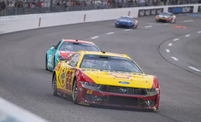 Team Penske driver Joey Logano (22) dives into turn one during Cook Out 400 at Richmond Raceway, Saturday, Aug. 15, 2026, in Richmond Va. (AP Photo/Robert Simmons)
