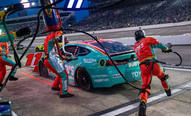 Joe Gibbs Racing driver Denny Hamlin (11) pit crew goes over the wall during Cook Out 400 at Richmond Raceway, Saturday, Aug. 15, 2026, in Richmond Va. (AP Photo/Robert Simmons)