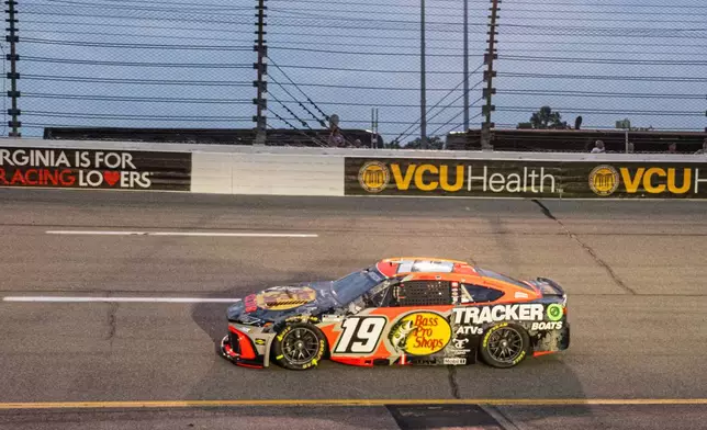 Joe Gibbs Racing driver Chase Briscoe (19) enters turn four during Cook Out 400 at Richmond Raceway, Saturday, Aug. 15, 2026, in Richmond Va. (AP Photo/Robert Simmons)