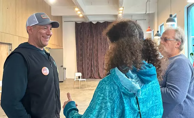 FILE - Alaska U.S. House candidate Bill Hill, an independent, speaks with people at a campaign fundraising event in Juneau, Alaska, June 4, 2026. (AP Photo/Becky Bohrer, File)