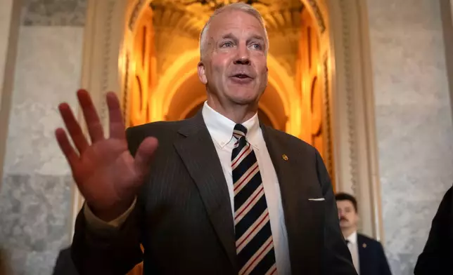 FILE - Sen. Dan Sullivan, R-Alaska, speaks to reporters at the Capitol in Washington, June 30, 2025. (AP Photo/Mark Schiefelbein)