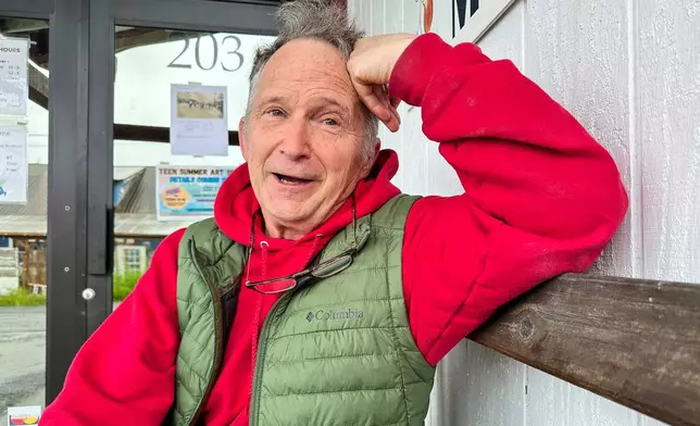 FILE - Dan Sullivan, a candidate in Alaska's U.S. Senate race who shares his name with the incumbent seeking reelection, talks with a reporter, July 3, 2026, in Petersburg, Alaska. (AP Photo/Becky Bohrer, File)