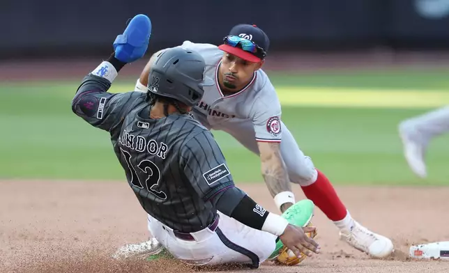 New York Mets' Francisco Lindor (12) is tagged out at second base by Washington Nationals second baseman Nasim Nuñez during the eighth inning of a baseball game, Saturday, Aug. 15, 2026, in New York. (AP Photo/Heather Khalifa)