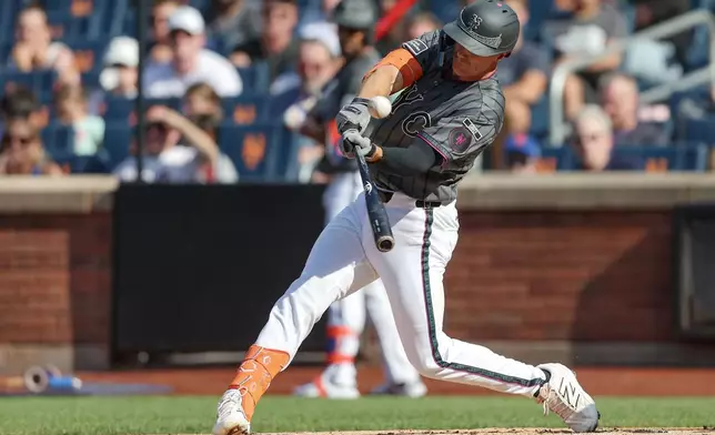 New York Mets' Jared Young connects on a double during the first inning of a baseball game against the Washington Nationals, Saturday, Aug. 15, 2026, in New York. (AP Photo/Heather Khalifa)