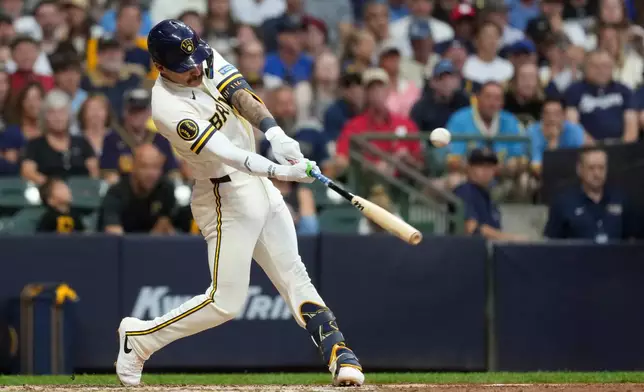 Milwaukee Brewers' Joey Ortiz hits an RBI single during the fifth inning of a baseball game against the Pittsburgh Pirates, Monday, Aug. 3, 2026, in Milwaukee. (AP Photo/Aaron Gash)