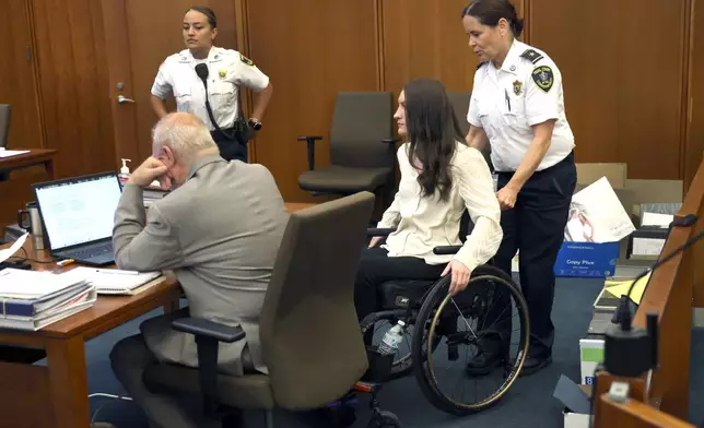 Lindsay Clancy enters the courtroom after a short break in her murder trial at Plymouth Superior Court in Plymouth, Mass., Wednesday, Aug. 5, 2026. (David L Ryan/The Boston Globe via AP, Pool) CORRECTION: Source is The Boston Globe, not The Boston Herald.