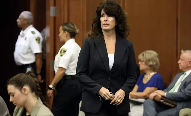 Elaine Rossi, the nanny to Clancy children, enters the courtroom to be a witness during Lindsay Clancy's murder trial at Plymouth Superior Court in Plymouth, Mass., Wednesday, Aug. 5, 2026. (David L Ryan/The Boston Globe via AP, Pool)