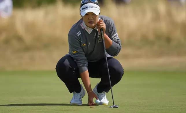 Haeran Ryu, of South Korea, lines up a putt on the 2nd green during the third round of the Women's British Open golf championship in Lytham St Annes, England, Saturday, Aug. 1, 2026. (AP Photo/Jon Super)
