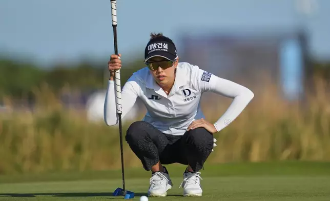 Yealimi Noh, of the Unites States, lines up a putt on the 17th green during the third round of the Women's British Open golf championship in Lytham St Annes, England, Saturday, Aug. 1, 2026. (AP Photo/Jon Super)