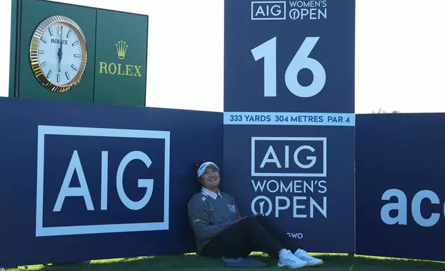 Haeran Ryu, of South Korea, sits on the 16th green during the third round of the Women's British Open golf championship in Lytham St Annes, England, Saturday, Aug. 1, 2026. (AP Photo/Jon Super)