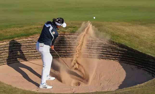 Jeeno Thitikul, of Thailand, plays a shot out of a bunker on the 17th green during the third round of the Women's British Open golf championship in Lytham St Annes, England, Saturday, Aug. 1, 2026. (AP Photo/Jon Super)
