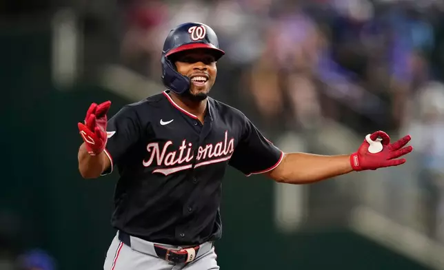 Washington Nationals' José Tena celebrates his solo home run in the third inning of a baseball game against the Texas Rangers Wednesday, Aug. 19, 2026, in Arlington, Texas. (AP Photo/Tony Gutierrez)