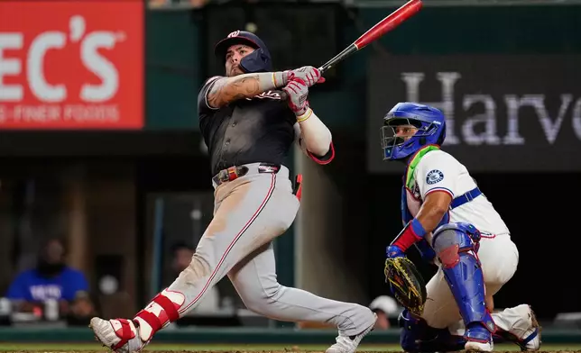 Washington Nationals' Andrés Chaparro follows through on a three-run home run as Texas Rangers catcher Elias Díaz looks on in seventh inning of a baseball game Wednesday, Aug. 19, 2026, in Arlington, Texas. (AP Photo/Tony Gutierrez)