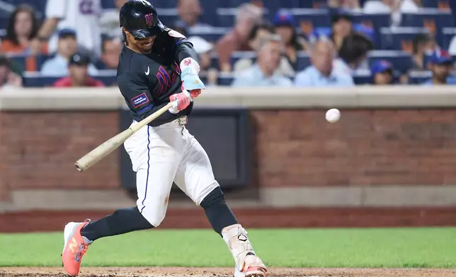 New York Mets' Francisco Lindor hits a home run during the sixth inning of a baseball game against the Washington Nationals, Friday, Aug. 14, 2026, in New York. (AP Photo/Heather Khalifa)