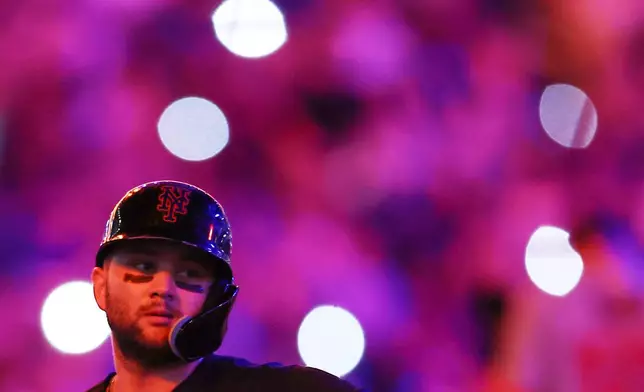 New York Mets' Bo Bichette looks on during a pitching change in the sixth inning of a baseball game against the Washington Nationals, Friday, Aug. 14, 2026, in New York. (AP Photo/Heather Khalifa)
