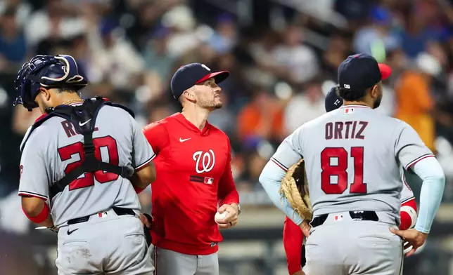 Washington Nationals manager Blake Butera looks on during a pitching change in the seventh inning of a baseball game against the New York Mets, Friday, Aug. 14, 2026, in New York. (AP Photo/Heather Khalifa)