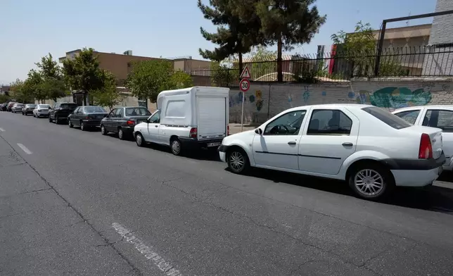 Cars line up outside a gas station in Tehran, Iran, Tuesday, Aug. 25, 2026. (AP Photo/Vahid Salemi)