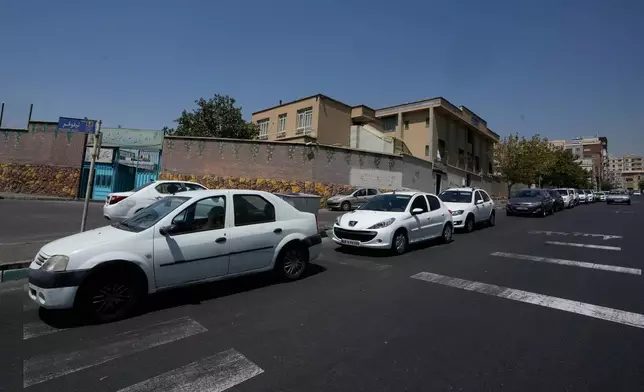 Cars line up outside a gas station in Tehran, Iran, Tuesday, Aug. 25, 2026. (AP Photo/Vahid Salemi)
