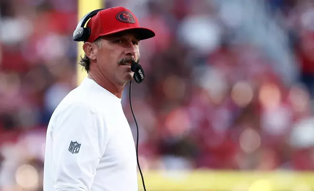 San Francisco 49ers head coach Kyle Shanahan watches from the sideline during the first half of a preseason NFL football game against the Tennessee Titans, Thursday, Aug. 13, 2026, in Santa Clara, Calif. (AP Photo/Kelley L. Cox)