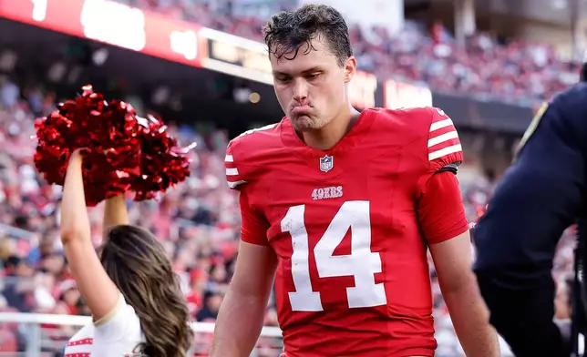 San Francisco 49ers quarterback Kurtis Rourke walks off the field during the first half of a preseason NFL football game against the Tennessee Titans, Thursday, Aug. 13, 2026, in Santa Clara, Calif. (AP Photo/Kelley L. Cox)