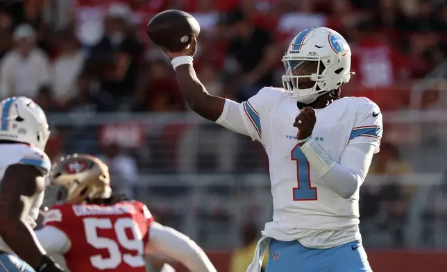 Tennessee Titans quarterback Cam Ward (1) passes against the San Francisco 49ers during the first half of a preseason NFL football game, Thursday, Aug. 13, 2026, in Santa Clara, Calif. (AP Photo/Jed Jacobsohn)