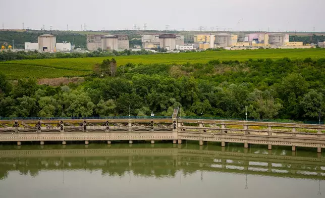 The Cernavoda Nuclear Power Plant, which had to close one of its reactors due to extremely low water levels, stands near the Danube River in Cernavoda, Romania, Monday, Aug. 3 2026. (AP Photo/Andreea Alexandru)