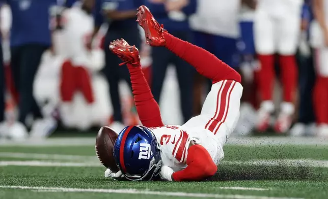New York Giants wide receiver Odell Beckham Jr. can't hold on for an incomplete pass during the first half of a preseason NFL football game against the New York Jets, Friday, Aug. 28, 2026, in East Rutherford, N.J. (AP Photo/Adam Hunger)
