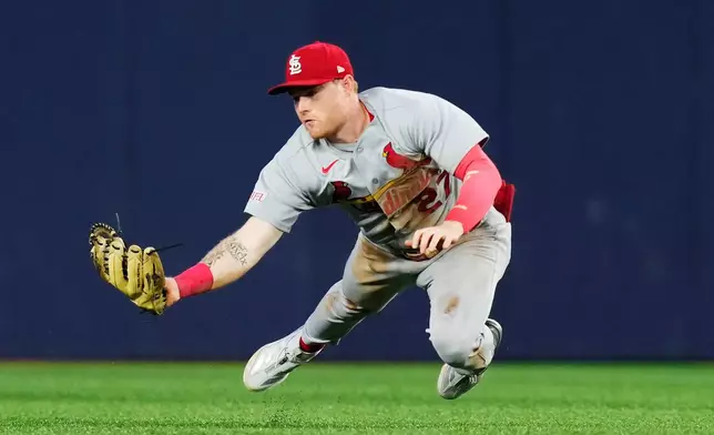 St. Louis Cardinals outfielder Nathan Church makes a diving catch on a ball hit by Toronto Blue Jays' Ernie Clement (22) during the sixth inning of a baseball game in Toronto, Friday, July 31, 2026. (Chris Young/The Canadian Press via AP)
