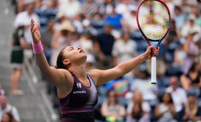 Jasmine Paolini, of Italy, reacts during the first round of the U.S. Open tennis championships against Veronika Erjavec, of Slovenia, Sunday, Aug. 30, 2026, in New York. (AP Photo/Yuki Iwamura)