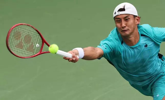 Sho Shimabukuro, of Japan, returns the ball to Arthur Rinderknech, of France, during the first round of the U.S. Open tennis championships, Sunday, Aug. 30, 2026, in New York. (AP Photo/Andres Kudacki)