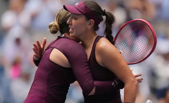 Jessica Pegula, of the United States, right, embraces Elena-Gabriela Ruse, of Romania, after Pegula won the first round of the U.S. Open tennis championships Sunday, Aug. 30, 2026, in New York. (AP Photo/Kirsty Wigglesworth)