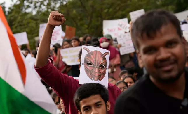 FILE- A participant wearing a cockroach mask attends a protest as part of a youth-led campaign demanding educational reforms in Bengaluru, India, Monday, July 20, 2026. (AP Photo/Aijaz Rahi, File)