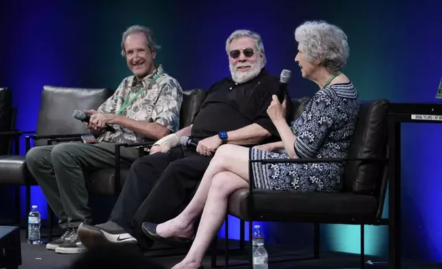 Apple co-founder Steve Wozniak, center, appears on stage at the Vintage Computer Festival in Mountain View, Calif., Sunday, Aug. 2, 2026. (AP Photo/Terry Chea)