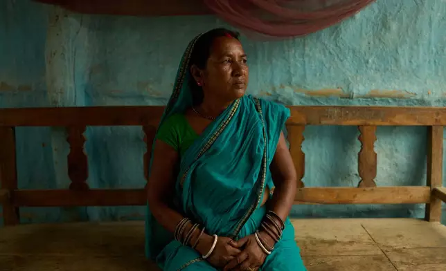 Rajkumari Patel, a community health worker trained to ensure impoverished pregnant women in rural Nepal receive timely prenatal care, poses for a portrait in her home in Gaur, Nepal, on May 20, 2026. (AP Photo/Bram Janssen)