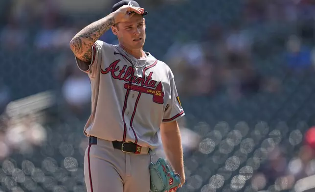 Atlanta Braves starting pitcher AJ Smith-Shawver stands on the mound after loading the bases during the third inning of a baseball game against the Minnesota Twins, Wednesday, Aug. 19, 2026, in Minneapolis. (AP Photo/Abbie Parr)