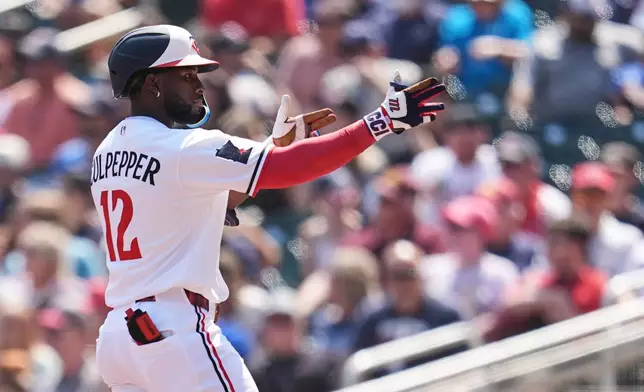 Minnesota Twins' Kaelen Culpepper (12) celebrates after hitting a single during the first inning of a baseball game against the Atlanta Braves, Wednesday, Aug. 19, 2026, in Minneapolis. (AP Photo/Abbie Parr)