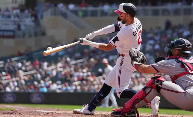 Minnesota Twins Kody Clemens hits a two-run double during the fifth inning of a baseball game against the Atlanta Braves, Wednesday, Aug. 19, 2026, in Minneapolis. (AP Photo/Abbie Parr)