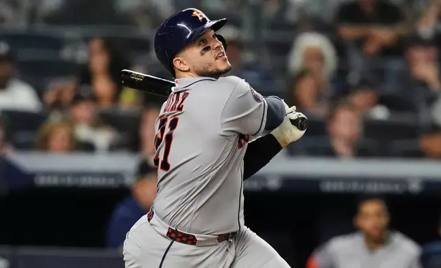Houston Astros' Yainer Diaz (21) hits a home run during the eighth inning of a baseball game against the New York Yankees Tuesday, Aug. 25, 2026, in New York. (AP Photo/Frank Franklin II)