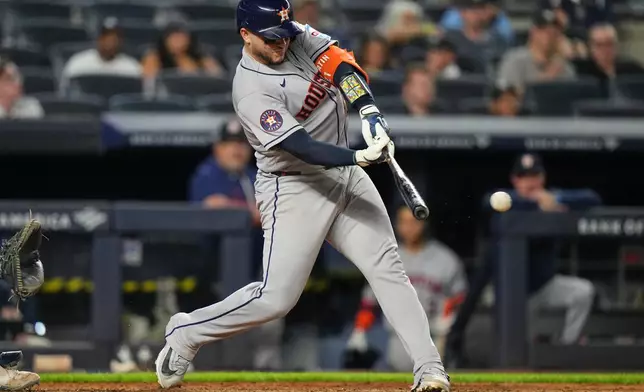 Houston Astros' Yainer Diaz hits an RBI single during the ninth inning of a baseball game against the New York Yankees Tuesday, Aug. 25, 2026, in New York. (AP Photo/Frank Franklin II)