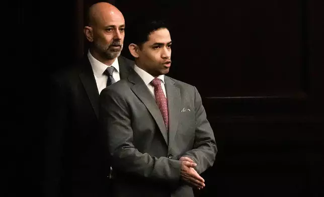 Defense Attorney James Hill, left walks in his client, defendant Mario Fernandez Saldana, during his trial on Tuesday, Aug. 25, 2026 at the Duval Count Courthouse in Jacksonville, Fla. [Doug Engle/The Florida Times-Union via AP, Pool)