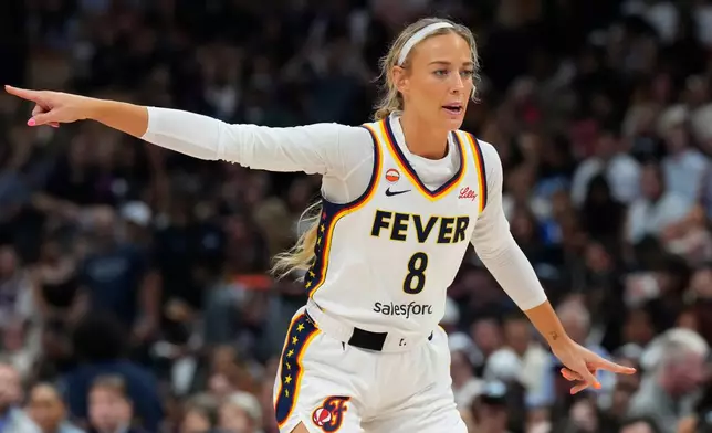 Indiana Fever's Sophie Cunningham (8) points during the first half of a WNBA basketball game in Toronto on Tuesday, Aug. 18, 2026. (Chris Young/The Canadian Press via AP)