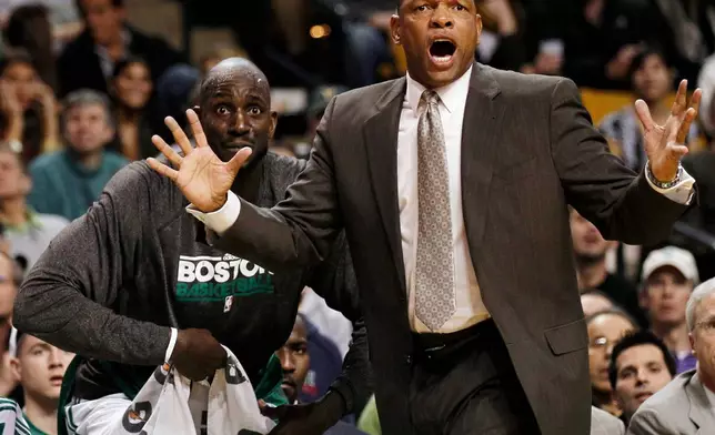 FILE - Boston Celtics coach Doc Rivers shouts at a referee as Kevin Garnett looks on during the first quarter of a NBA basketball game against the New Jersey Nets in Boston, Nov. 24, 2010. (AP Photo/Winslow Townson, File)