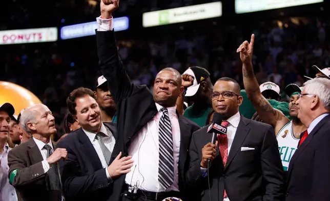 FILE - Head coach Doc Rivers and Boston Celtics team owner Steve Pagliuca, second from left, celebrate after defeating the Los Angeles Lakers in Game 6 of the NBA basketball finals, June 17, 2008, in Boston. (AP Photo/Elise Amendola, File)