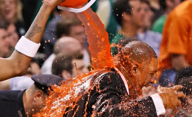 FILE - Boston Celtics coach Doc Rivers gets a Gatorade shower from Paul Pierce as the Celtics win the NBA Championship over the Los Angeles Lakers in Game 6 of the NBA basketball finals, June 17, 2008, in Boston. (AP Photo/Elise Amendola, File)