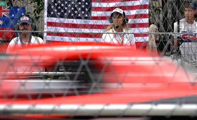 A race track official observes a car participating in a practice run for the IROC auto race, Saturday, Aug. 22, 2026, in Washington. (AP Photo/John McDonnell)
