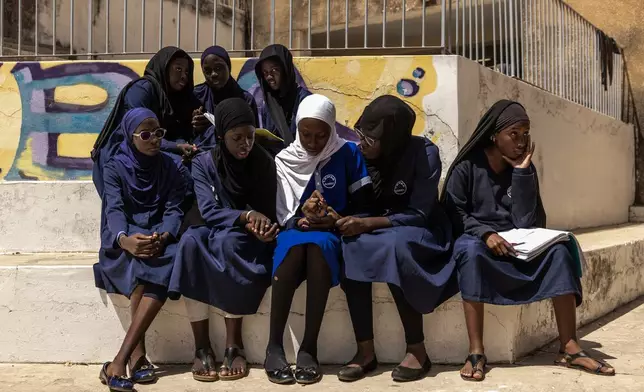 Students study at the Mariama Ba School in Goree Island Senegal, Thursday, March 12, 2026. (AP Photo/Caitlin Kelly)