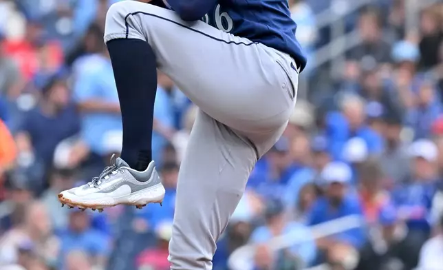 Seattle Mariners starting pitcher Logan Gilbert winds up to deliver to a Toronto Blue Jays batter during the first inning of a baseball game in Toronto, Sunday, Aug. 30, 2026. (Jon Blacker/The Canadian Press via AP)
