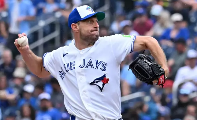 Toronto Blue Jays pitcher Max Scherzer throws to a Seattle Mariners batter during the first inning of a baseball game in Toronto, Sunday, Aug. 30, 2026. (Jon Blacker/The Canadian Press via AP)