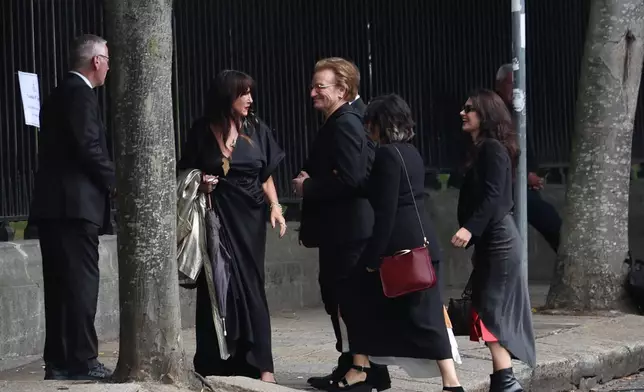 Bono arrives for the funeral of Glen Hansard at St Patrick's Cathedral in Dublin, Tuesday, Aug. 4, 2026. (Damien Eagers/PA via AP)